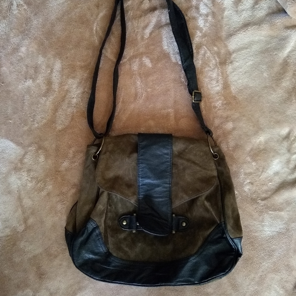 Green and black suede handbag